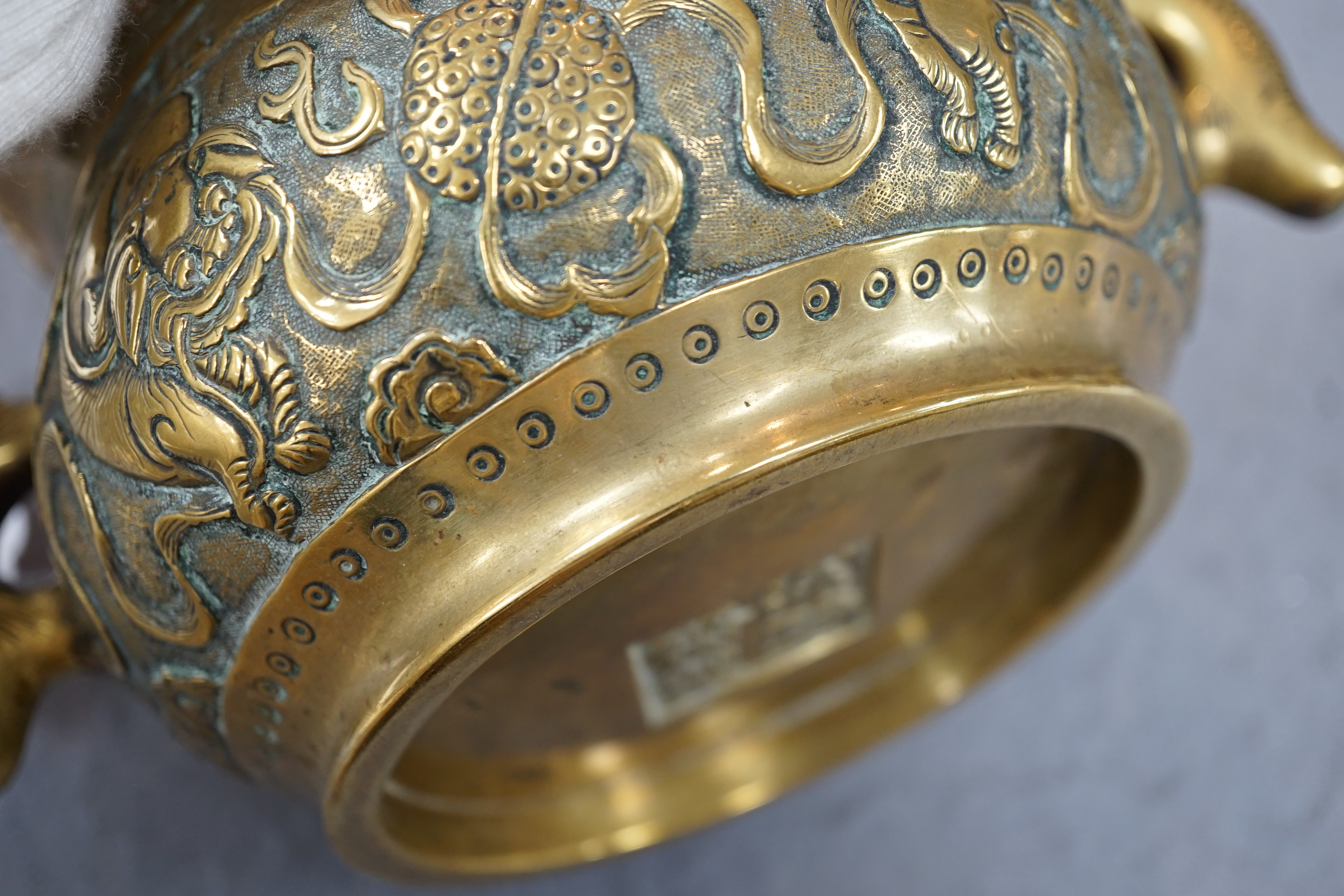 A Chinese polished bronze ‘Buddhist lion’ censer, gui, 19th century, 19.5cm wide, rim diameter 14cm